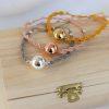 bracelet réglable avec boule d'harmonie